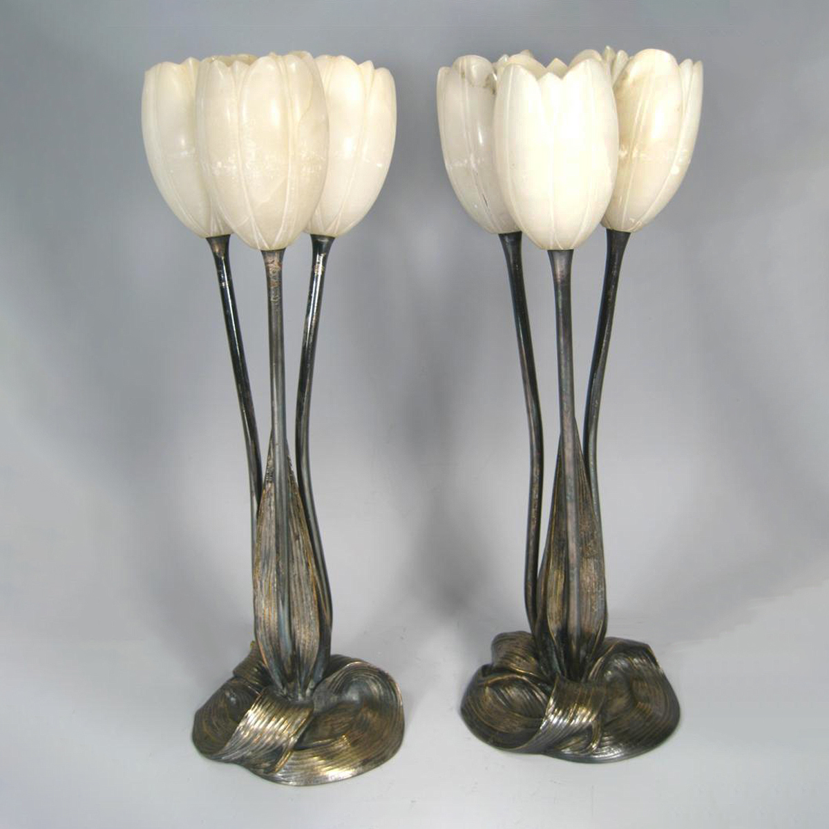 Pair of Art Nouveau/Art Deco silvered bronze and alabaster tulip form table lamps