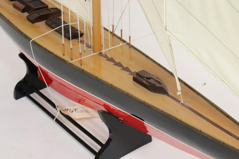 Model of a Red & Black Painted Sailboat on Stand