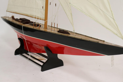 Model of a Red & Black Painted Sailboat on Stand