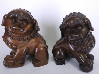 Image for Lot Matching Hardwood Stands with two Carved Foo Dogs