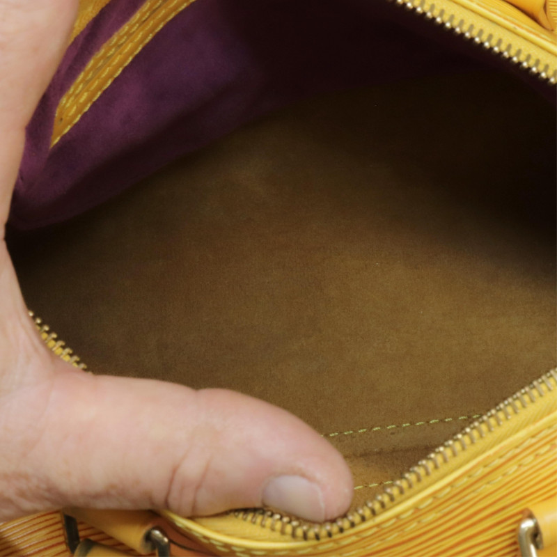 Sold at Auction: Louis Vuitton Yellow Epi Leather 25 Speedy Handbag, with  golden brass hardware, opening to a yellow suede interior with small purple