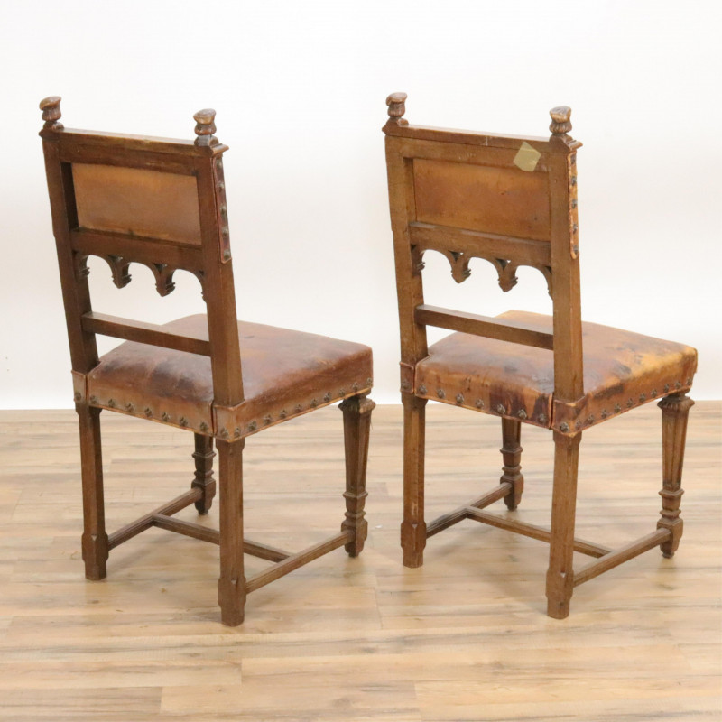 Five Gothic Revival Carved and Leather Side Chairs
