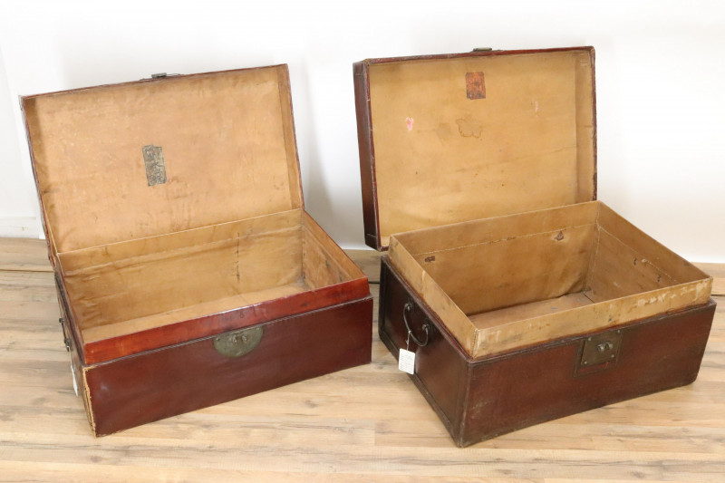 Two Similar Chinese Burgundy Leather Trunks
