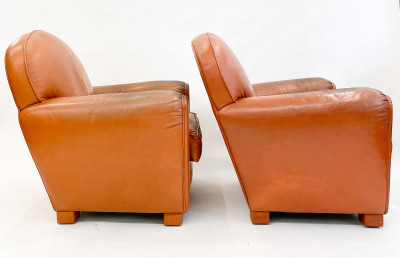 Leather club chairs and ottoman in the style of Ralph Lauren