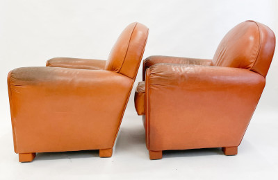 Leather club chairs and ottoman in the style of Ralph Lauren