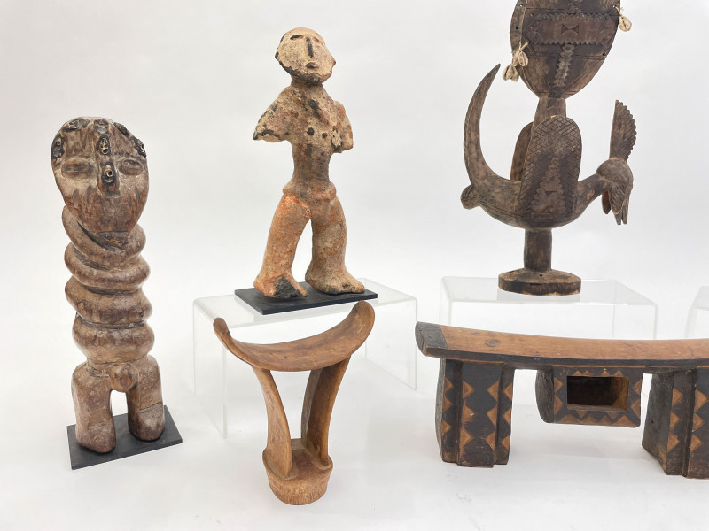 Group of 8 African figures and head rests