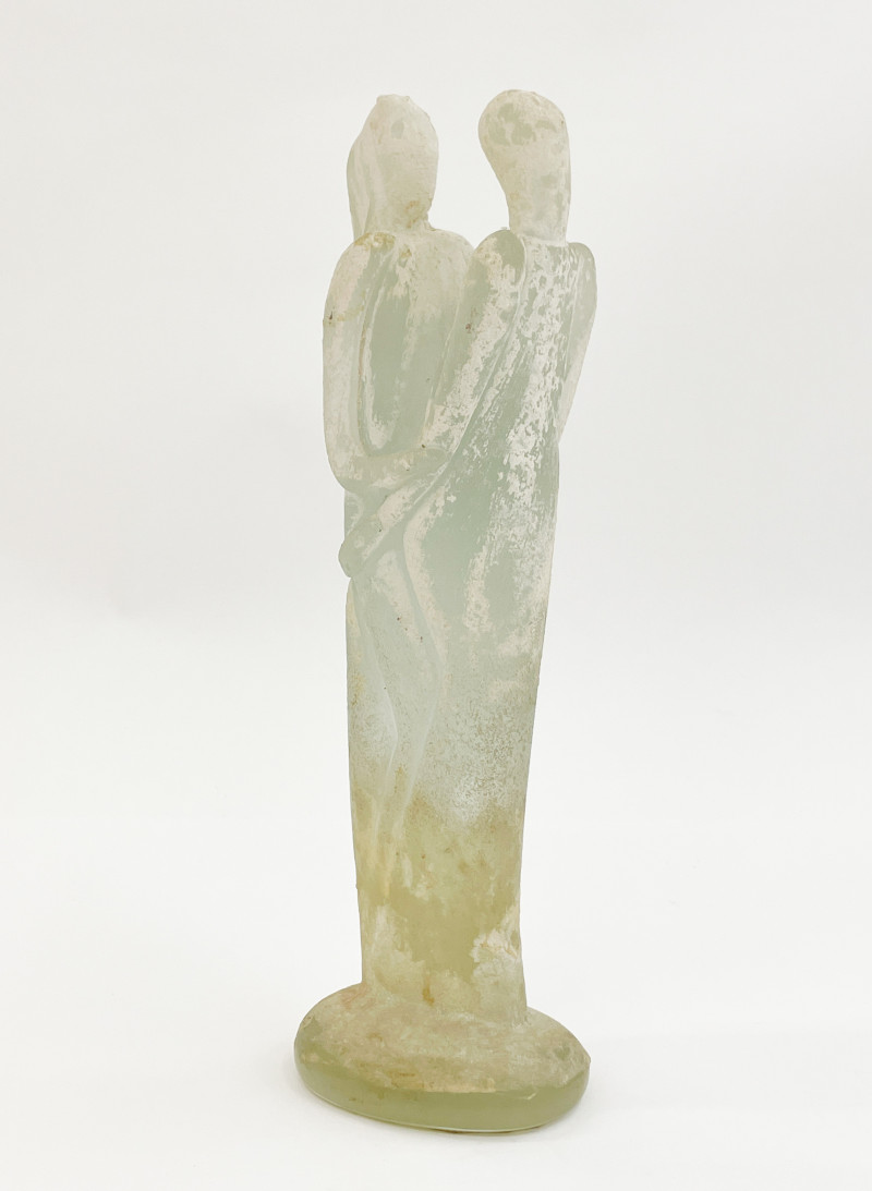 Glass sculpture of embracing figures