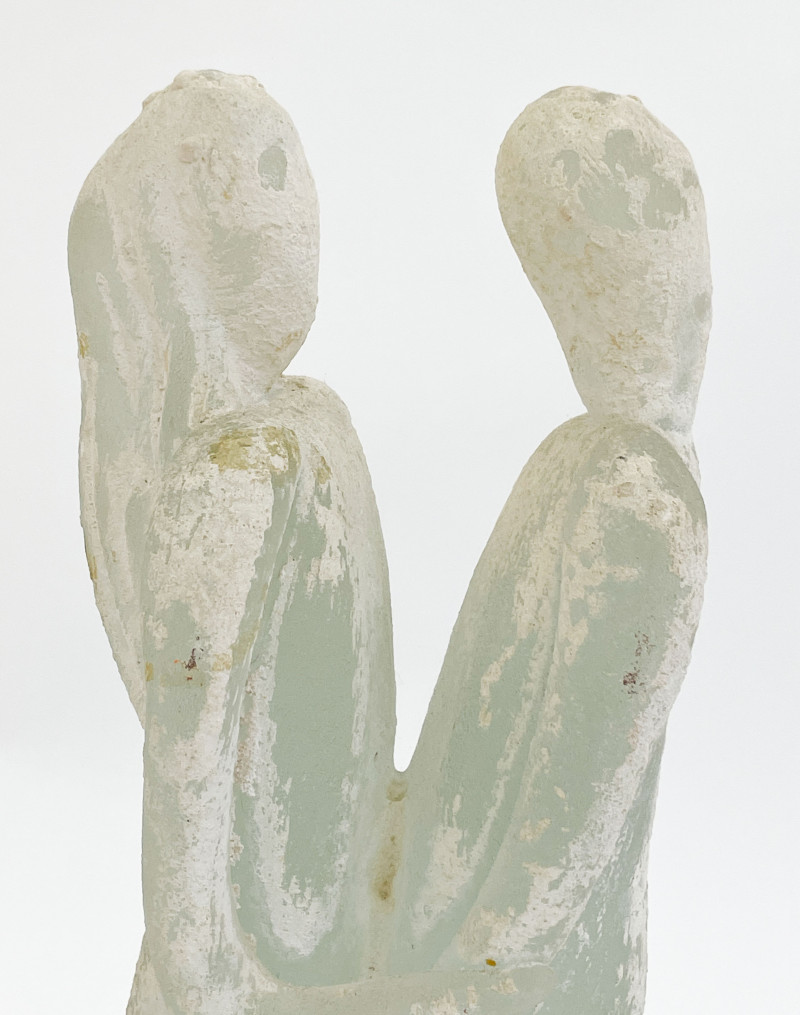Glass sculpture of embracing figures