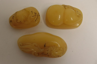 8 Asian Butterscotch Amber Carvings