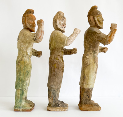 Three Chinese Green Glazed Figures of Grooms