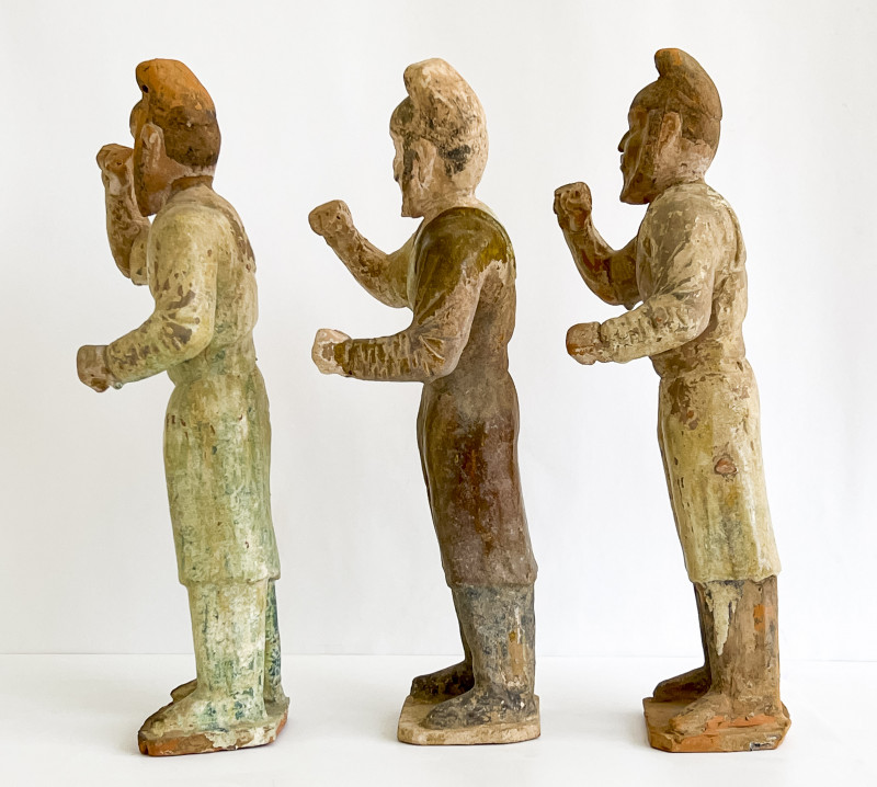 Three Chinese Green Glazed Figures of Grooms