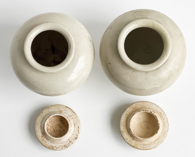 Pair of Chinese White Glazed Ovoid Jars and Covers