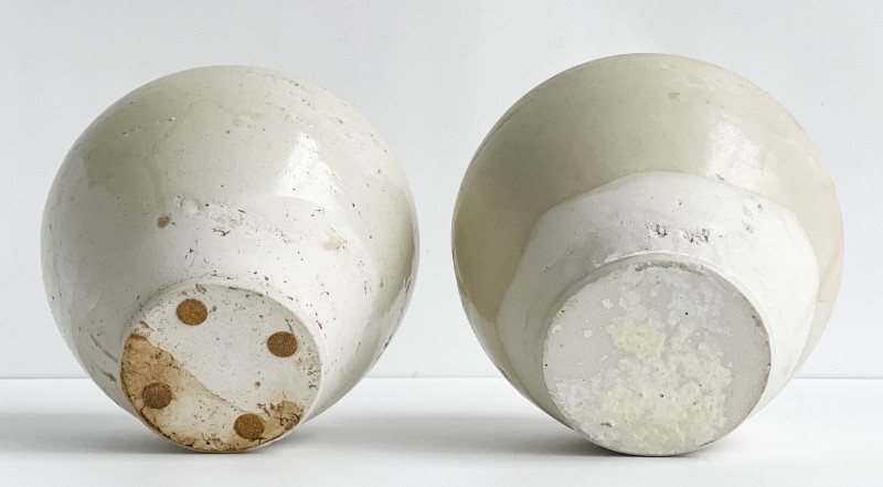 Pair of Chinese White Glazed Ovoid Jars and Covers