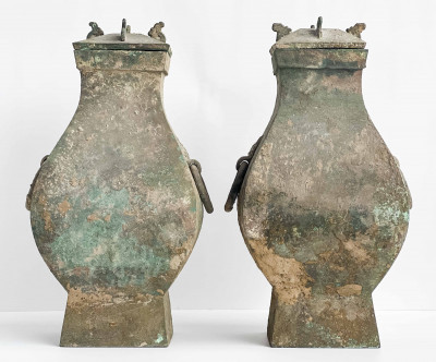 Pair of Chinese Bronze Fanghu Form Vessels and Covers