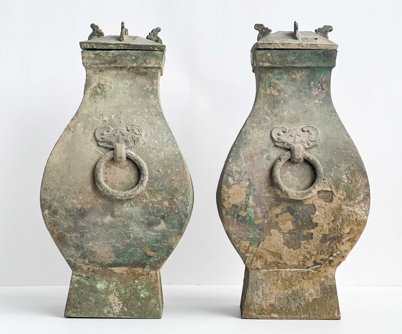 Pair of Chinese Bronze Fanghu Form Vessels and Covers