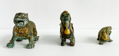 Three Chinese Parcel Gilt Bronze Figures of Lions