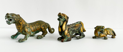 Image for Lot Three Chinese Parcel Gilt Bronze Figures of Lions