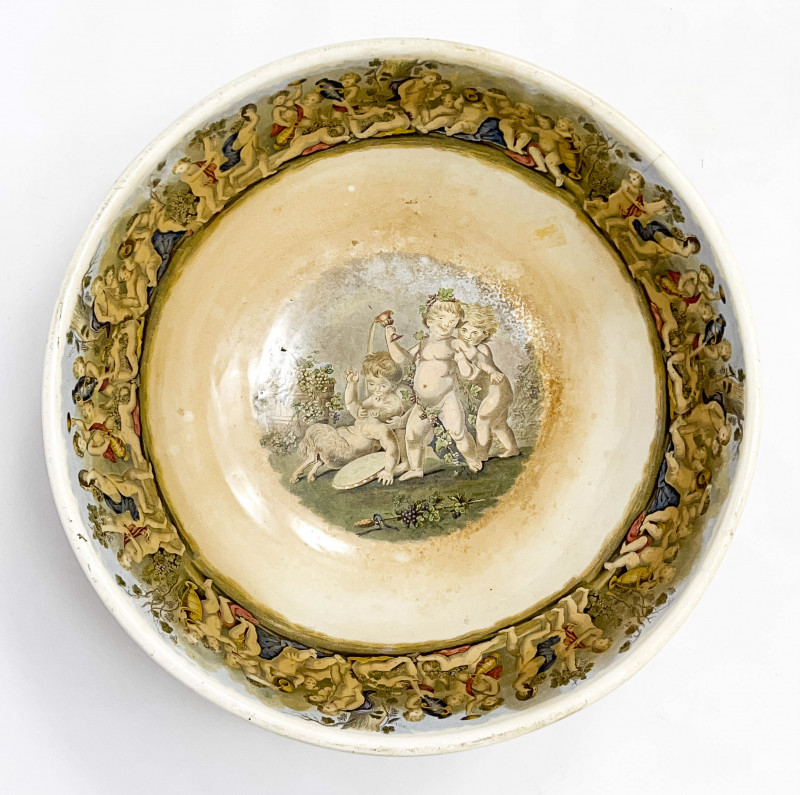 Large Footed Earthenware Punch Bowl with Cherub Motif