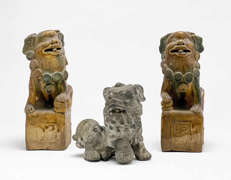Pair of Chinese Glazed Ceramic Buddhist Lions and a Small Lion