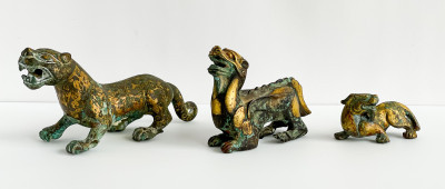 Image for Lot Three Chinese Parcel Gilt Bronze Figures of Lions