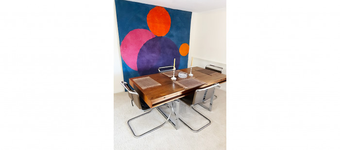 Herbert Bayer's tapestry pictured with other items offered in the sale, including a set of 4 Mies Van Der Rohe for Knoll chairs and the Bodil Kjær Executive Desk 