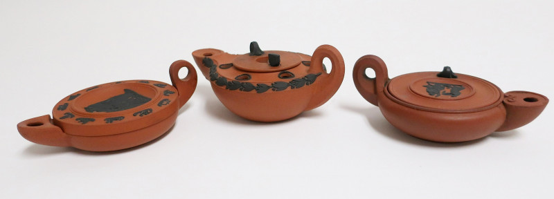 Image 3 of lot 3 Wedgwood Rosso Antico Oil Lamps