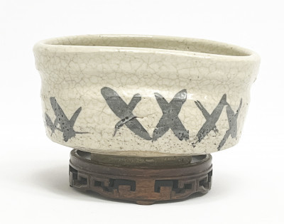 Title Japanese Stoneware "Shoe Shaped" Tea Bowl (Kutsugata Chawan) / Artist