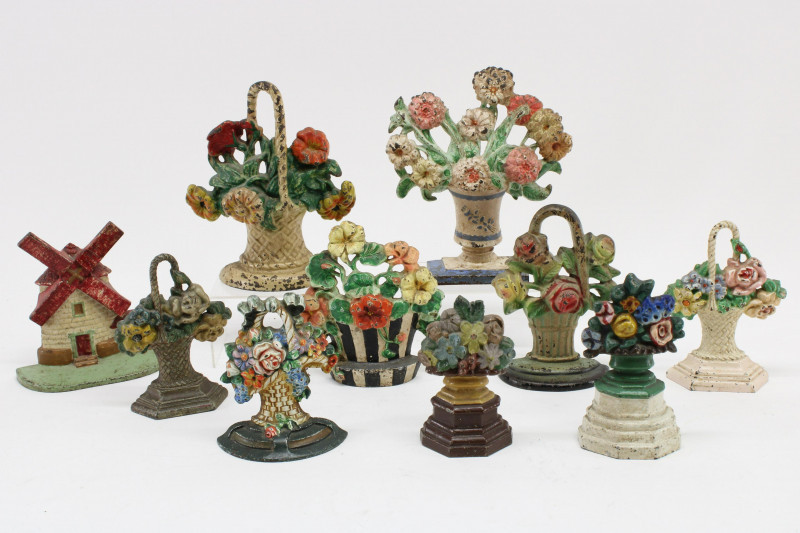 Image 1 of lot 10 Cast Iron Doorstops; floral baskets, windmill